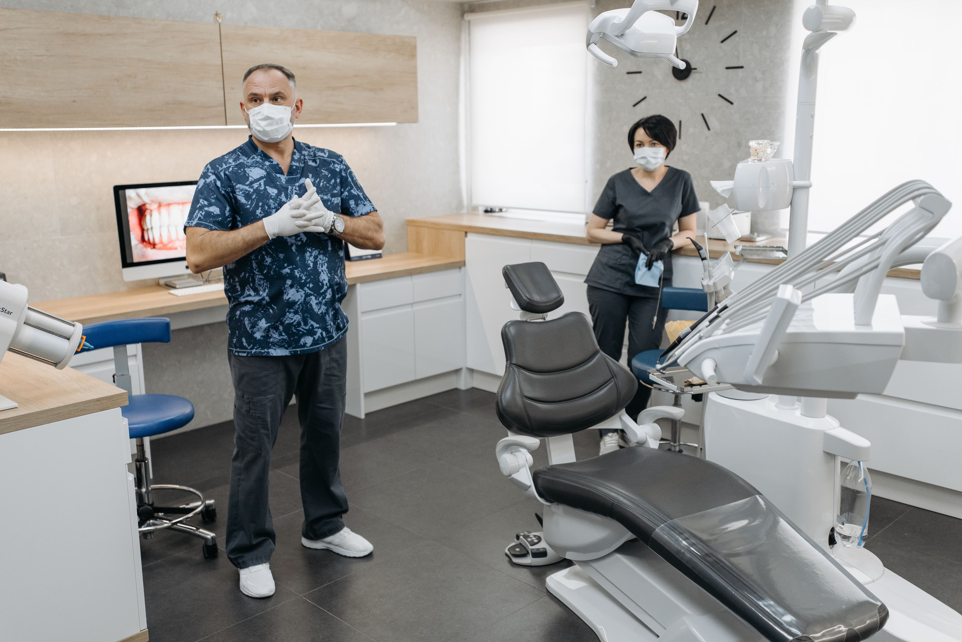 Dental hygienist assisting in treatment room